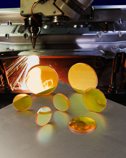 CO2 Laser Focusing Lenses As Field Replacements For Steel Cutting Lasers