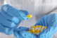 Doctor holding antibiotic pills-GettyImages-2271436785