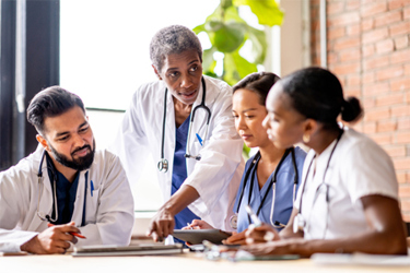 GettyImages-2010746888-clinical-meeting-tablet-collaboration