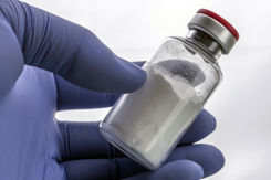 hand holding vial-GettyImages-951661874