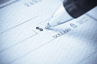 Pen being used to write a check-GettyImages-173602091