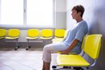 Patient sitting in waiting room-GettyImages-629772380