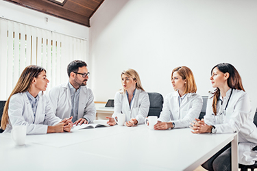doctor clinical trial meeting iStock-986569806