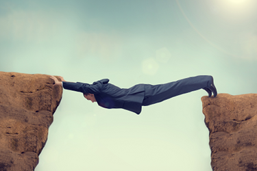 Businessman-Across-Gap-Cliff Businessman-Across-Gap-Cliff