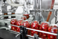 Production Line Of Cherries In Jars GettyImages-1359339799