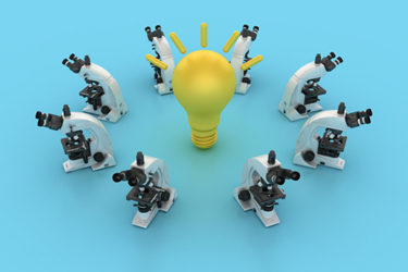Circle of Microscopes with Light Bulb-GettyImages-2294487444 Circle of Microscopes with Light Bulb-GettyImages-2294487444