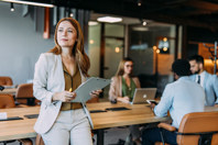 GettyImages-2169869893-business-woman-office-building-team-table