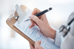 medical worker write documents, data and questions for report, planning or clinic administration-GettyImages-1511333905