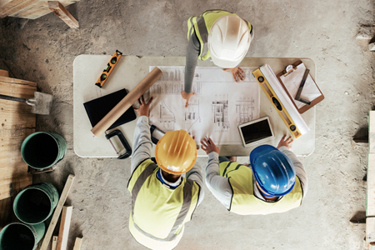 construction workers or blueprint planning-GettyImages-1447581973