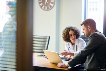 GettyImages-1268717577-doctor-meeting-with-business-professional-computer-office GettyImages-1268717577-doctor-meeting-with-business-professional-computer-office