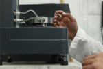 GettyImages-1218315246-rheometer-lab-scientist-hand