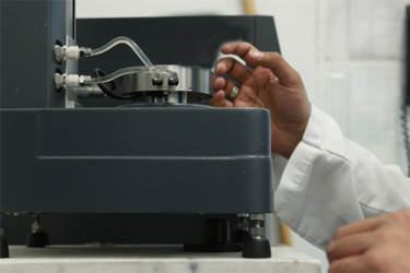 GettyImages-1218315246-rheometer-lab-scientist-hand