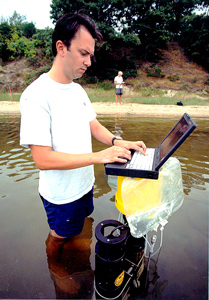 Marine chemist Matt Charette and WHOI colleagues have greatly advanced the measurement of submarine groundwater discharge--the flow of fresh, underground water into the ocean and salty sea water into aquifers--over the past decade. (Photo by Tom Kleindinst, Woods Hole Oceanographic Institution)
