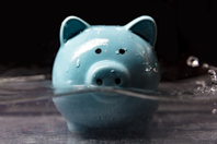 getty-1220670049-water-money-piggy-bank