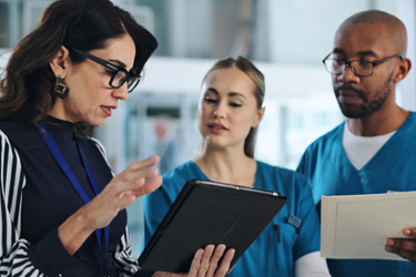 Medical team, tablet, meeting-GettyImages-2177971058