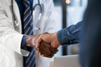 Doctor Shaking Patient's Hand GettyImages-1684218936