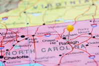 CDMOs Cluster In North Carolina: Why It Matters To You Raleigh pinned on a map-iStock-535340111
