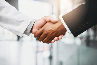 doctor and businessman shaking hands-GettyImages-1098284170 doctor and businessman shaking hands-GettyImages-1098284170