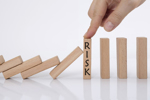 Principles And Concepts Of System Risk Structures For Understanding & Managing Risks domino effect and risk management concept iStock-1272805554