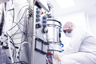 Scientist in a cleanroom laboratory-GettyImages-675822682