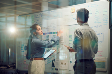 GettyImages-2148853397-whiteboard-people-strategy-thinking-writing-ipad GettyImages-2148853397-whiteboard-people-strategy-thinking-writing-ipad