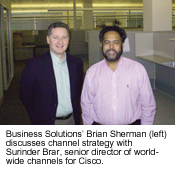 Business Solutions' Brian Sherman (left) discusses channel strategy with Surinder Brar, senior director of worldwide channels for Cisco.