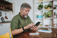 Checking prescription on smartphone-GettyImages-1719535353