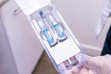 Pharmaceutical syringe packaging GettyImages-1187896742