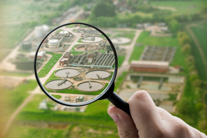 wastewater treatment plant through magnifying glass-GettyImages-2256447238