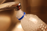 Filling Water Bottle from the Tap-iStock-145836022