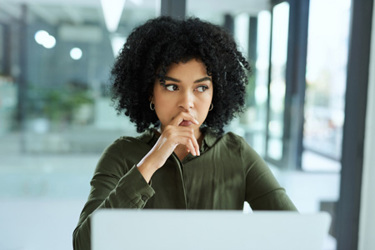 young businesswoman thinking-GettyImages-1307840993