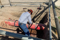Installers prepares the pipe before fitting the AVT EZ Valve