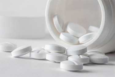 GettyImages-1370147753-white-tablets-pill-bottle