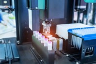 IVD And CDx: Comprehensive Services From Research To Regulatory GettyImages-2158862132-vials-robotic-arm-filling-liquid-handling-lab