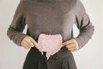 GettyImages-1494992361 Woman hands holding intestine shape