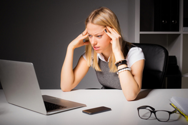 Business woman looking at laptop-GettyImages-503422576 Business woman looking at laptop-GettyImages-503422576