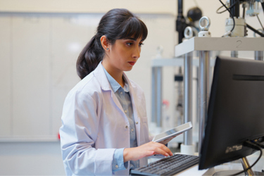 GettyImages-2199680273-lab-computer-scientist-in-lab-coat