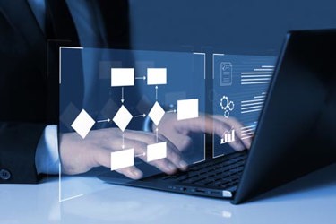 GettyImages-1413755087-business-man-computer-data-workflow-automation