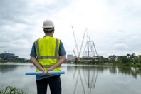 Engineer working at construction site-3GettyImages-1332339489