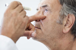 Elderly man with optomologist-GettyImages-840513864