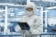 GettyImages-2150276083-lab-mask-tablet-PPE-cleanroom