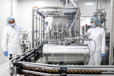 workers in lab wearing protective gear-GettyImages-1417392226 workers in lab wearing protective gear-GettyImages-1417392226