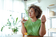 Woman taking medications-GettyImages-1782441970