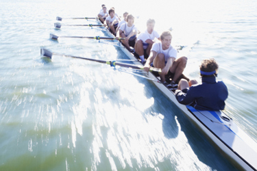 Men in row boat oaring-GettyImages-129179508
