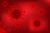 Cleaning And Disinfecting For Viruses And Other Pathogens Viruses On Red Background GettyImages-1044016410