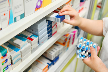 Pharmacist Holding Medicine GettyImages-878852718 Pharmacist Holding Medicine GettyImages-878852718
