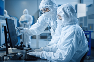 GettyImages-1294339670-lab-cleanroom-PPE-computer-team