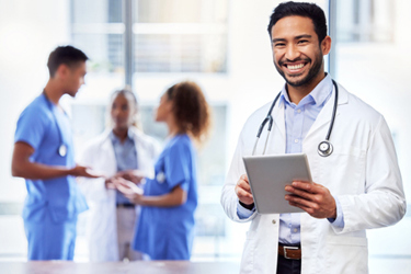male doctor with diigital tablet-GettyImages-1383445193 male doctor with diigital tablet-GettyImages-1383445193