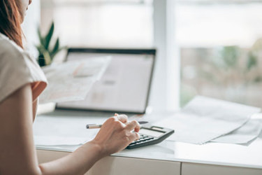 GettyImages-1325860496-patient-calculator-tax-finance