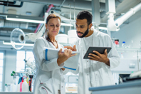 Strategies For Ensuring Virus Bank Manufacturing Success GettyImages-1441662840-lab-team-communication-collaboration
